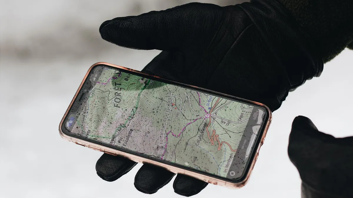 Checking mobile signal and offline maps on a coastal road in Ireland